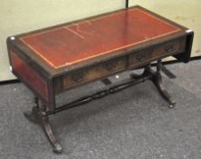 A leather topped drop leaf coffee table, of rectangular form, with two short drawers to the front,