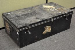 A black painted travelling trunk,