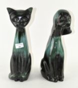 A Canadian Blue Mountain cat and dog figure,