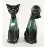 A Canadian Blue Mountain cat and dog figure,