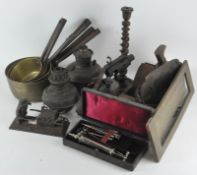 A collection of assorted items, including vintage blow torch, brass graduating saucepans,