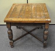 A mid-century oak extending dining table,