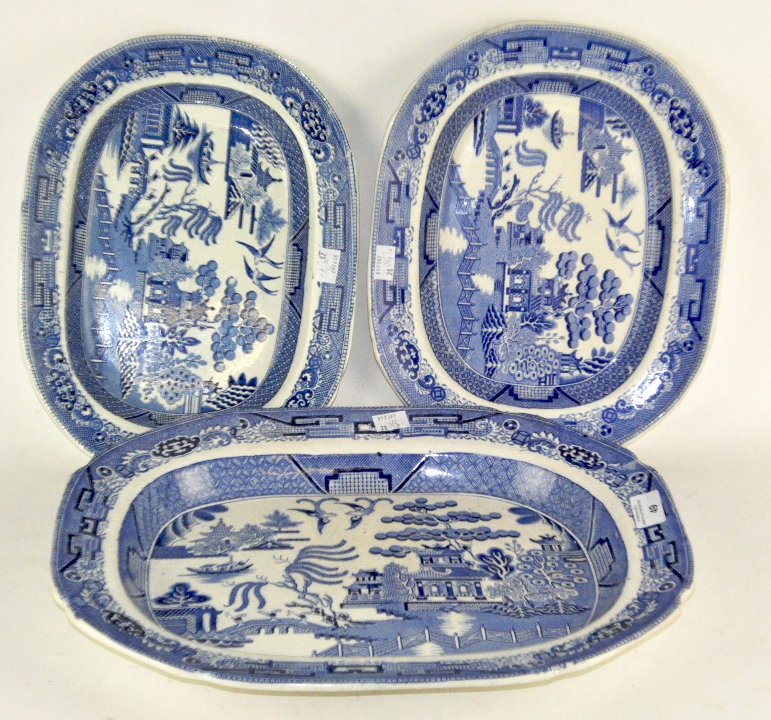 Three blue and white ceramic meat platters, one marked 'Staffordshire Stone china'.