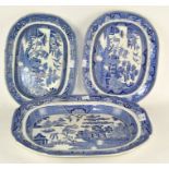 Three blue and white ceramic meat platters, one marked 'Staffordshire Stone china'.