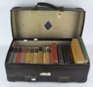 A vintage 'Revelation' leather suitcase/travelling case,along with a collection of books,