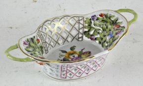 A Herend porcelain hand painted dish, twin handled with pierced interior,