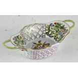 A Herend porcelain hand painted dish, twin handled with pierced interior,