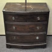 A late 19th century mahogany bow fronted chest of three drawers,