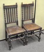 A pair of 19th century oak dining chairs, with resin drop in seats,