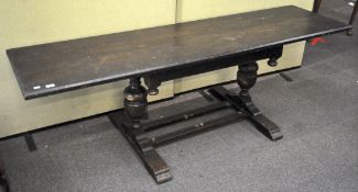 A late 19th/early 20th century stained refectory dining table, of long rectangular form,