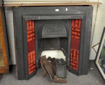 A metal fire surround with red tiles with wooden mantle. Fire surround 96cm wide, 95cm high.