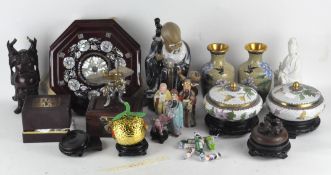 A collection of Oriental curios, top include cloisonne vases, ceramic figures, buddhas,