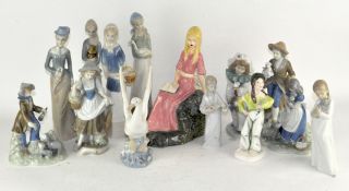 A collection of Lladro style figures,