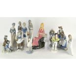 A collection of Lladro style figures,