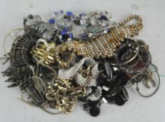 A tin of costume jewellery, to include bangles,