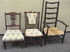 Two 19th century mahogany low chairs with matching upholstery, one with inlaid detailing to back,