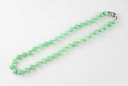 A single strand green mottled hardstone beaded necklace, 16 inch.