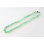 A single strand green mottled hardstone beaded necklace, 16 inch.