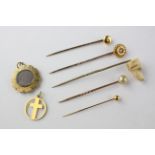 A collection of jewellery to include five tie pins, a mourning pendant and a cross pendant.