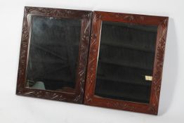A pair of Eastern rosewood mirrors,