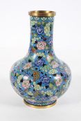 A Chinese cloisonne bottle vase, with butterflies, chrysanthemum and other flowers on a blue ground,