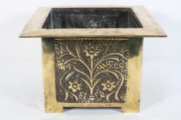 A brass Arts and Crafts style jardiniere, of square section,