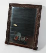 A mahogany over mantel mirror, the rectangular plate inside a carved frame,