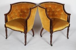 A pair of mahogany framed tub chairs, circa 1900, with a buttoned back,