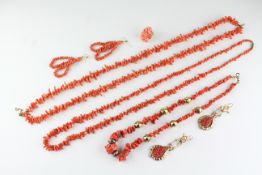 A collection of coral jewellery to include three necklaces,