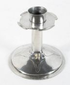 An Arts and Crafts pewter candlestick,