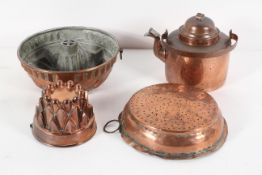 A copper mould, of 'castellated' form, 16cm diameter; another larger, of circular ring form,