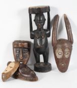 Tribal Art : Four African carved wood masks, sub-Saharan,