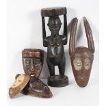 Tribal Art : Four African carved wood masks, sub-Saharan,