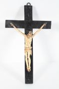 A medieval style bone Corpus Christi suspended from an ebonised cross, 16th century,