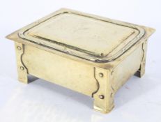 An Arts and Crafts style hammered brass cigarette box and cover, of rectangular form, circa 1910,