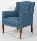 A 19th century upholstered armchair, on square tapering mahogany legs with brass castors and wheels,