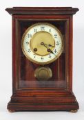 A Continental mantel clock, the 11cm ivorine chapter ring on a brass eight day movement,