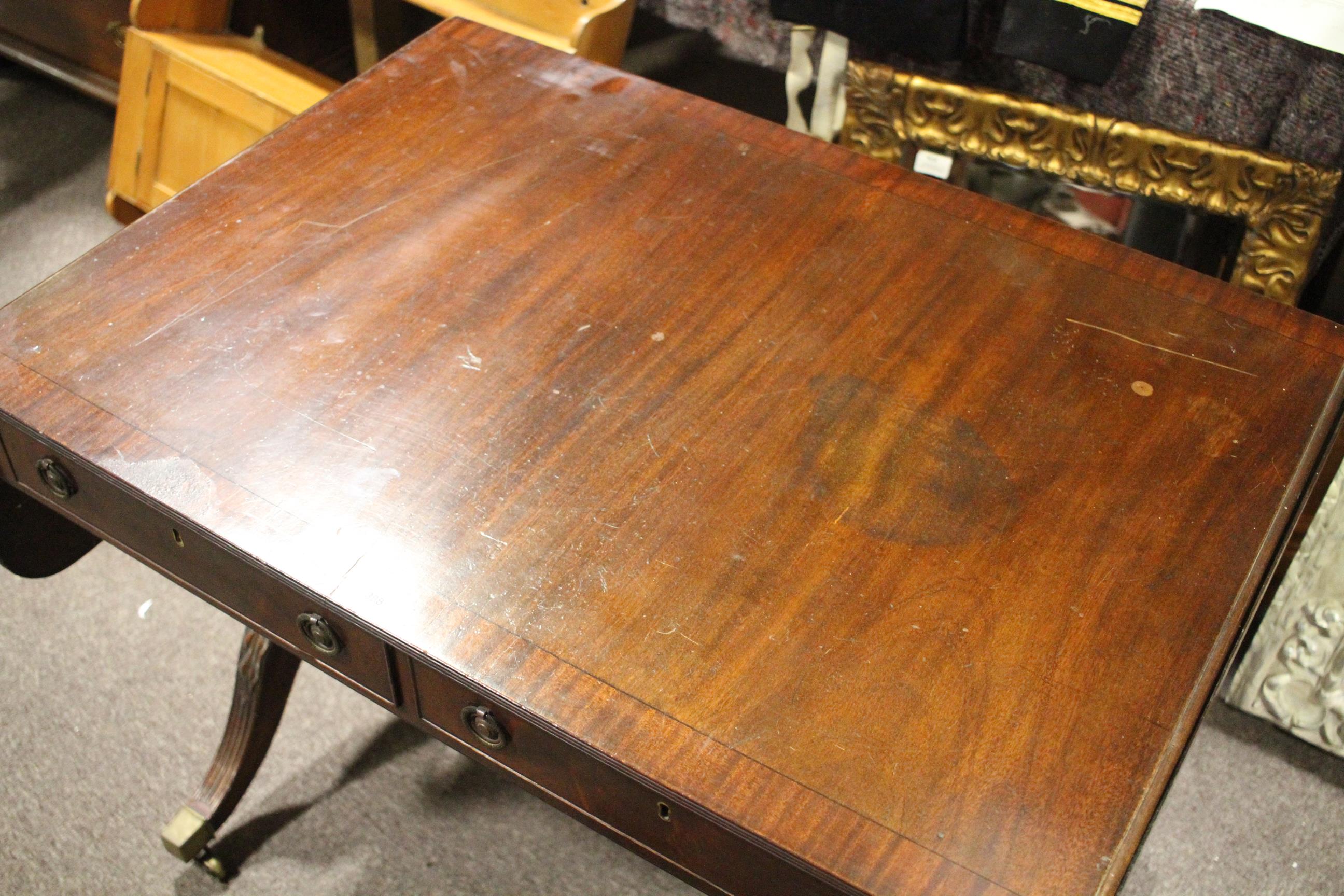A Regency style mahogany and cross banded sofa table, drop leaves and two true drawers, - Image 6 of 11