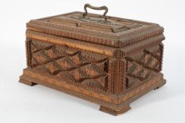 A Dutch wooden casket and cover, 19th century, with geometric decoration,