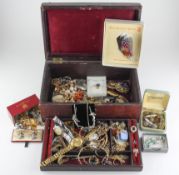 A jewellery case containing a large selection of assorted costume jewellery and wristwatches