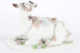 A Samson figure of a Meissen style recumbent cow, on a flower encrusted base,