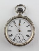 An open face pocket watch. Circular white dial with Roman numerals. Mechanical unsigned movement.