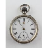 An open face pocket watch. Circular white dial with Roman numerals. Mechanical unsigned movement.