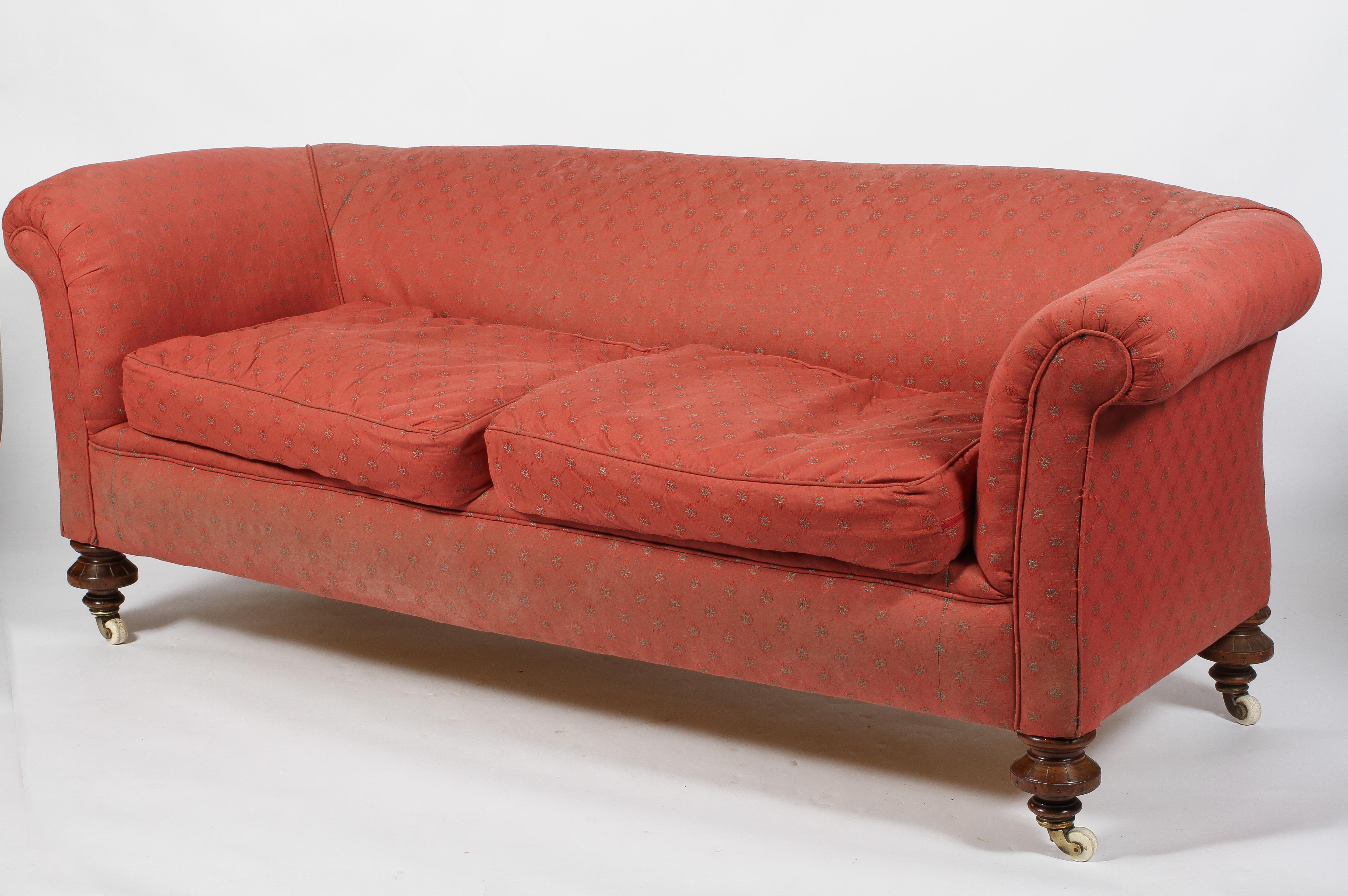 A 19th century Chesterfield two seat sofa, upholstered in red, with two drop-in cushions, - Image 3 of 3