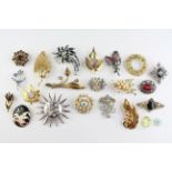 A collection of twenty costume brooches of variable designs.