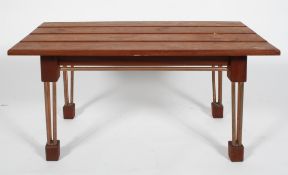 A 20th century bespoke coffee table, with teak wood slatted top, copper tube legs and block feet,