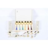 A collection of Norwegian 925 silver gilt spoons and forks, in three boxes,