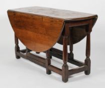 An oak gate leg dining table, late 18th century, with single drawer,