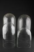 A near pair of glass domes, of circular section,