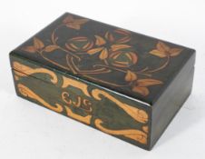 A Scottish Arts and Crafts wooden box and cover,